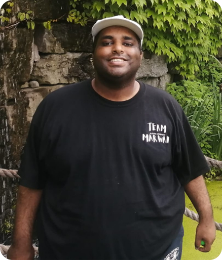 Marwan, smiling, wearing a Team Marwan shirt