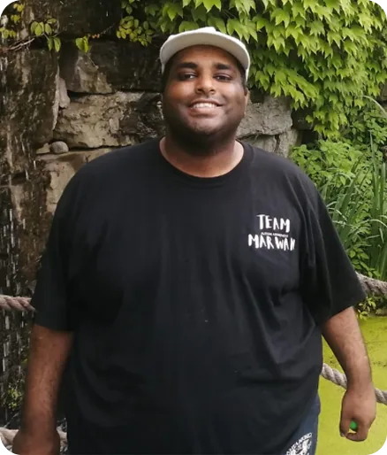 Marwan, smiling, wearing a Team Marwan shirt